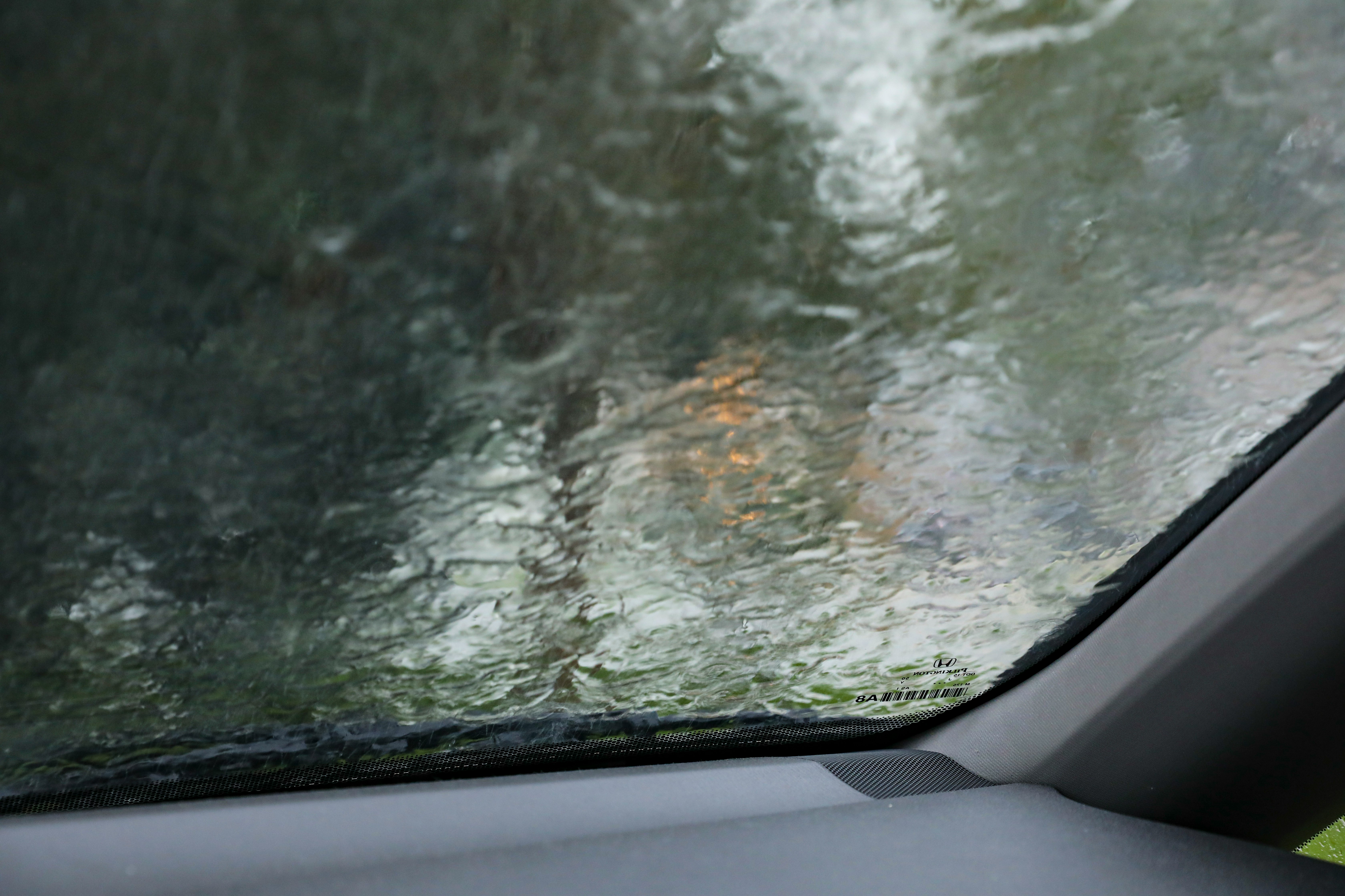 car window with water droplets